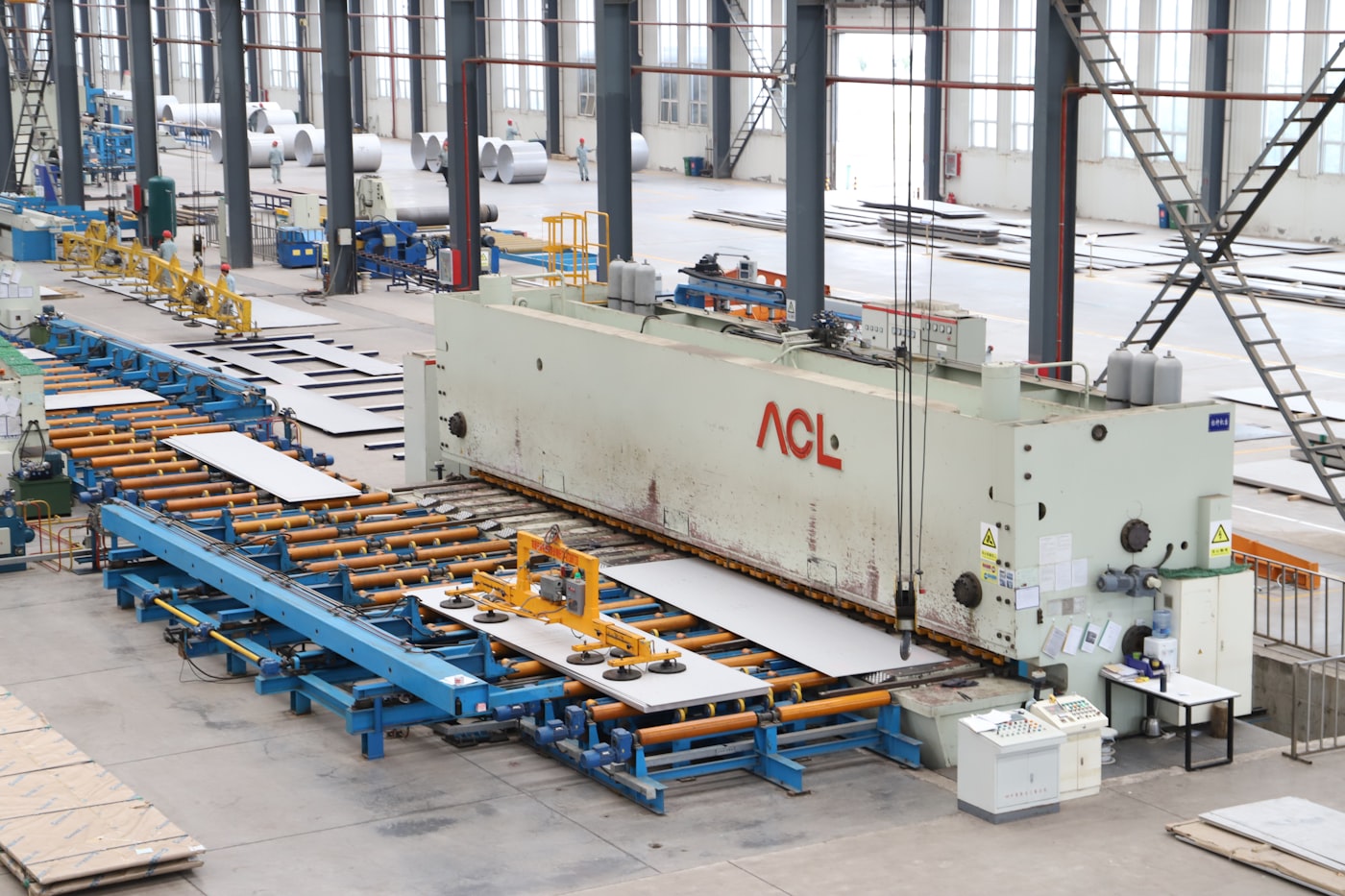 Metal fabrication press and CNC machinery inside a workshop
