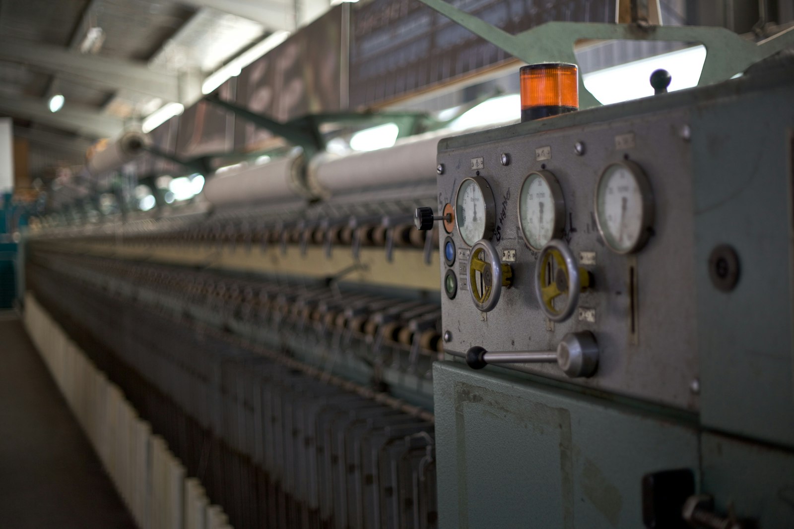 Engineer reviewing equipment on a factory floor