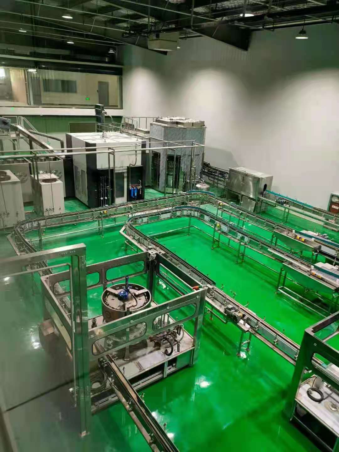 Overhead view of bottled water line with conveyors and equipment blocks