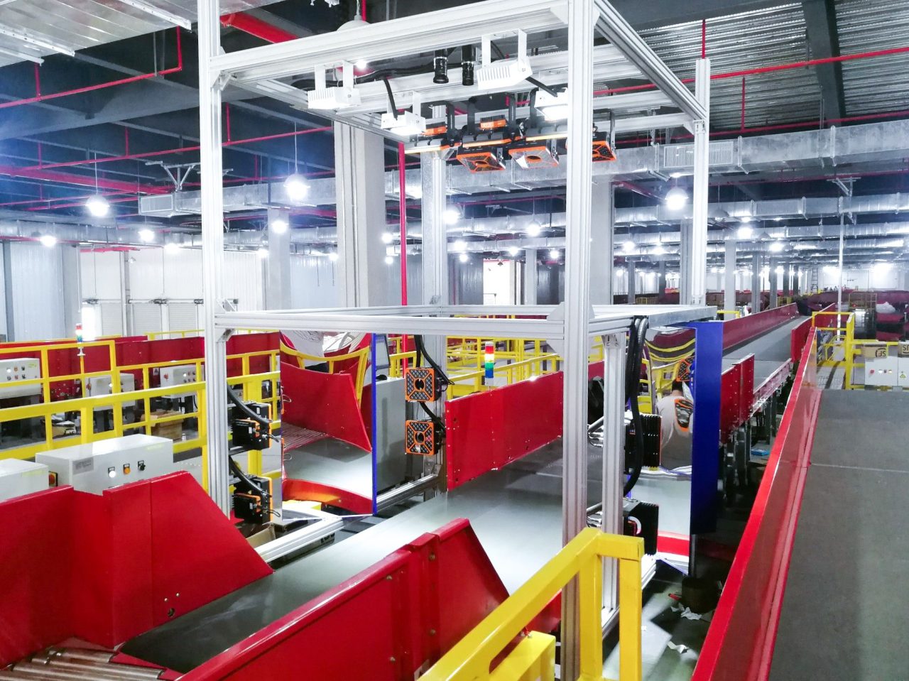 Machine vision cameras mounted over a conveyor for automated optical inspection (AOI) on a production line